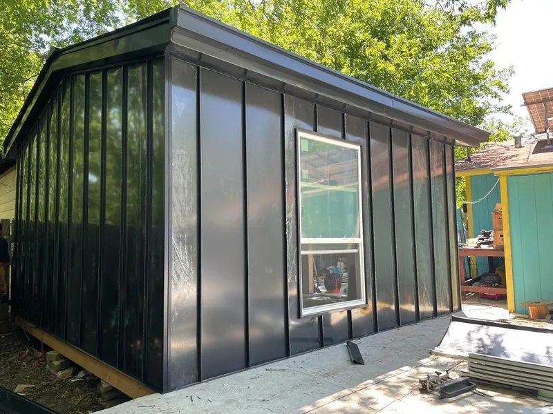 Black standing seam metal wall panels for Roof Inspection in Harrisville