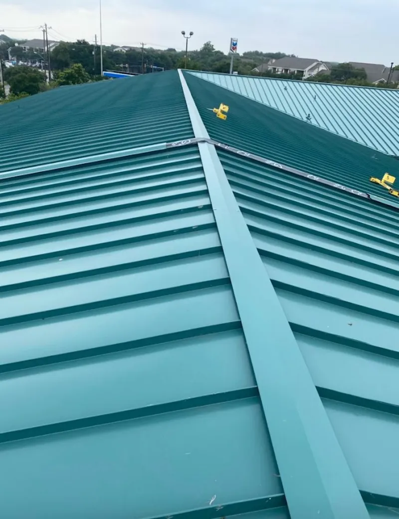 Green commercial metal roof ridge and valley for Metal Roof Repair in Harrisville