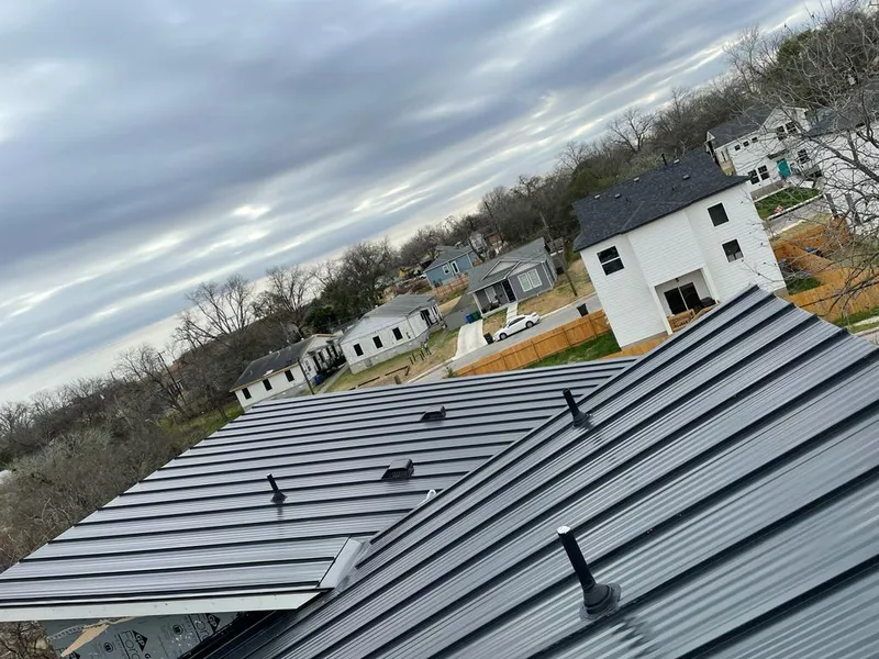 Standing seam metal roof panels with vents for Skylight Repair in Harrisville